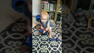 Amazing 17 pound infant baby lifting heavy weights rocky style listening to survivor