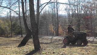 John deere 330 pulling tree branches