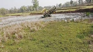 John deere 5045 4wheel  cagewheel stuck in mud.