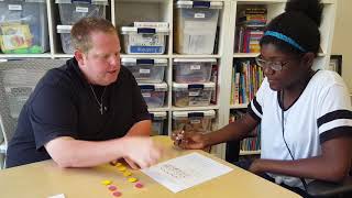 Video Example: A tutor asks a student to find common denominators with manipulatives.