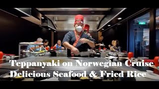 Teppanyaki chef cooking fried rice and seafood (scallops, prawns & calamari) onboard Norwegian Sun