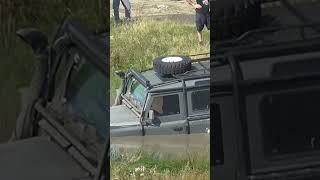 land rover defender in deep water stuck