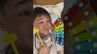 Baby tries playing the xylophone for the first time