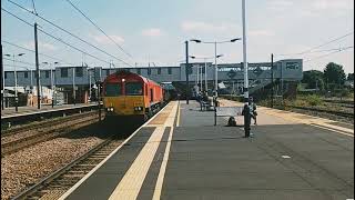 DB Schenker liveried 66014 heading through Peterborough Station to Heck Plasmor in Yorkshire.