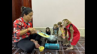 4 Siblings Standing Up Very Over The Moon While Mom Cooking Dinner For Them ,