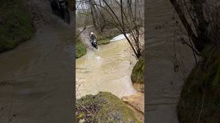 Crossing creek on dirt bike