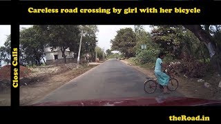 Girl on a Bicycle Crossing Road Carelessly