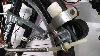 experimental motor as generator mounting to bike front wheel