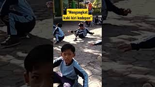 gerak bertumpu dan keseimbangan-jongkok mengangkat kaki kiri kedepan #shorts #pjok #gpjokbelajar