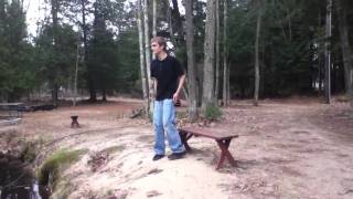 A Man Sits on a Bench.