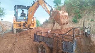 Excavation work on construction site by JCB