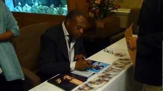 Michael Winslow from Police Academy & Gremlins signing several autographs - TopSignatures.com