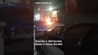 Protesters torch Hassan Nasrallah banner in Qarchak | Iran protests