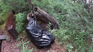 Getting trash out of cliff side cabin. Camp Lost Lake