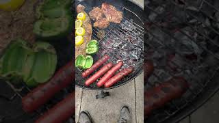 grilling on the weber 22" charcoal grill salmon, sausages peppers