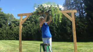 Installation of Flowers to a Wooden Arbor