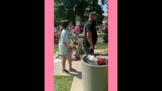 Flowers and crosses containing the names of the 21 victims of the horrific shooting in Uvalde Town.