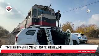 Yük treninin otomobile çarpması sonucu 2 kişi yaralandı