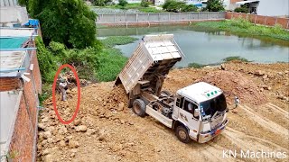 Good Experient Landfill By Bulldozer D31P Komatsu Pushing Soil Into Water And Truck 5T Unloading