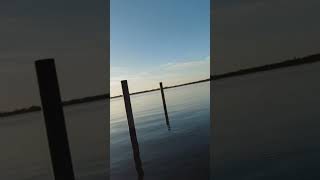 Smooth as glass! Drone flight over the lake at sunset