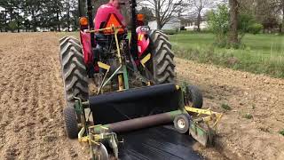 Leveling dirt and laying plastic mulch