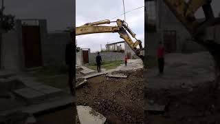 Excavator digging ground to install water pipe