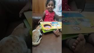 Reading books to kitty. Kitty love Aaira at 2.10years