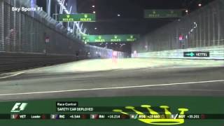 Sebastian Vettel shouts as a fan strolls along F1 track during Singapore Grand Prix