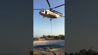 Kazdağları yangın sonrası soğutma çalışmalarında , su havuzlarından helikopter ile su alımı