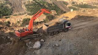 Hitachi excavator loading dump truck!