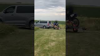 Man on a Dirt Bike gets Towed by a Truck