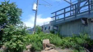 Nan railroad bridge with an acela on it at a new angle