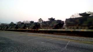 Really long train with lots of military cargo.