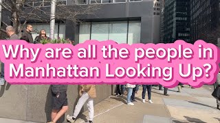 Why are so many People in NYC looking Up?