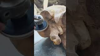 The woodcarver makes a stool.  Elephant with a chainsaw