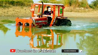 Mf 385 tractor crossing canal | Tractor crossing deep water.