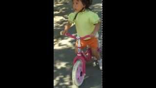 Sarah cruising on her balance bike in Vasona Park