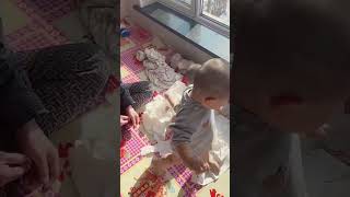 Both babies spread toilet paper all over the room