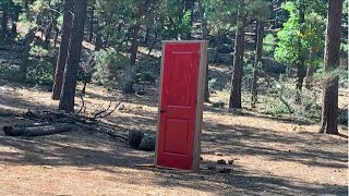 RANDOM RED DOOR IN THE MIDDLE OF THE WOODS???