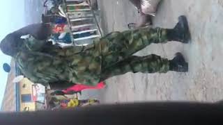 Soldier seen beating a woman in Ibadan for 'indecent' dressing,