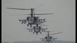 Kamovs Ka-52 Alligator go on patrol accompanied by a Mil Mi - 8 Hip