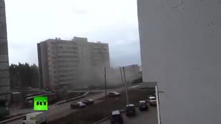 A Construction Crane Falls, On An Apartment Building.