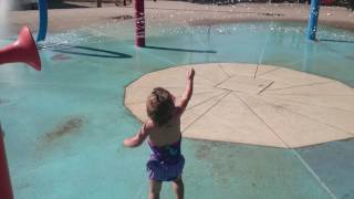 Scarlett playing at the splash pad