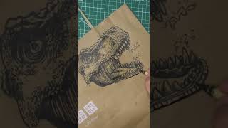 Roar into Fashion with this Stylish T-Rex Illustration on UNIQLO Paper Bag