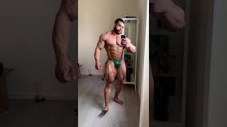 Handsome muscle god Sahar Kazes in green posing trunks