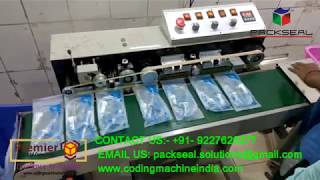 HIGH SPEED CONTINOUS BAND SEALER WITH AIR SUCTION AND BATCH CODING