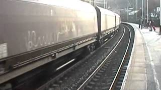 EWS 66051 thunders through Keighley as a Northern 158 arrives