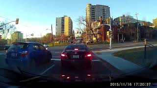 Car makes illegal right turn and gets stuck on a traffic island (watch left side)