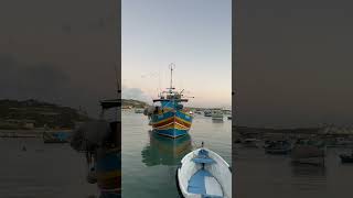 What to visit in Malta, Europe: the traditional fishing village of Marsaxlokk | cloudy sunset