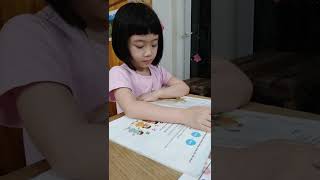 Su practices reading Vietnamese